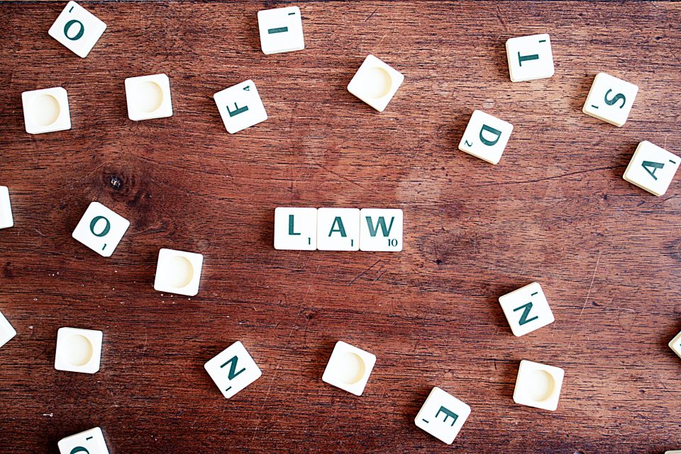 scrabble tiles spelling the word Law. Photo by CQF-Avocat from Pexels